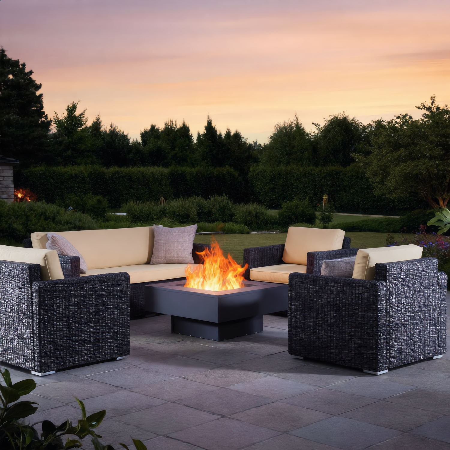 Steel garden fire pit burning wood in a British garden lifestyle setting — Pyrova