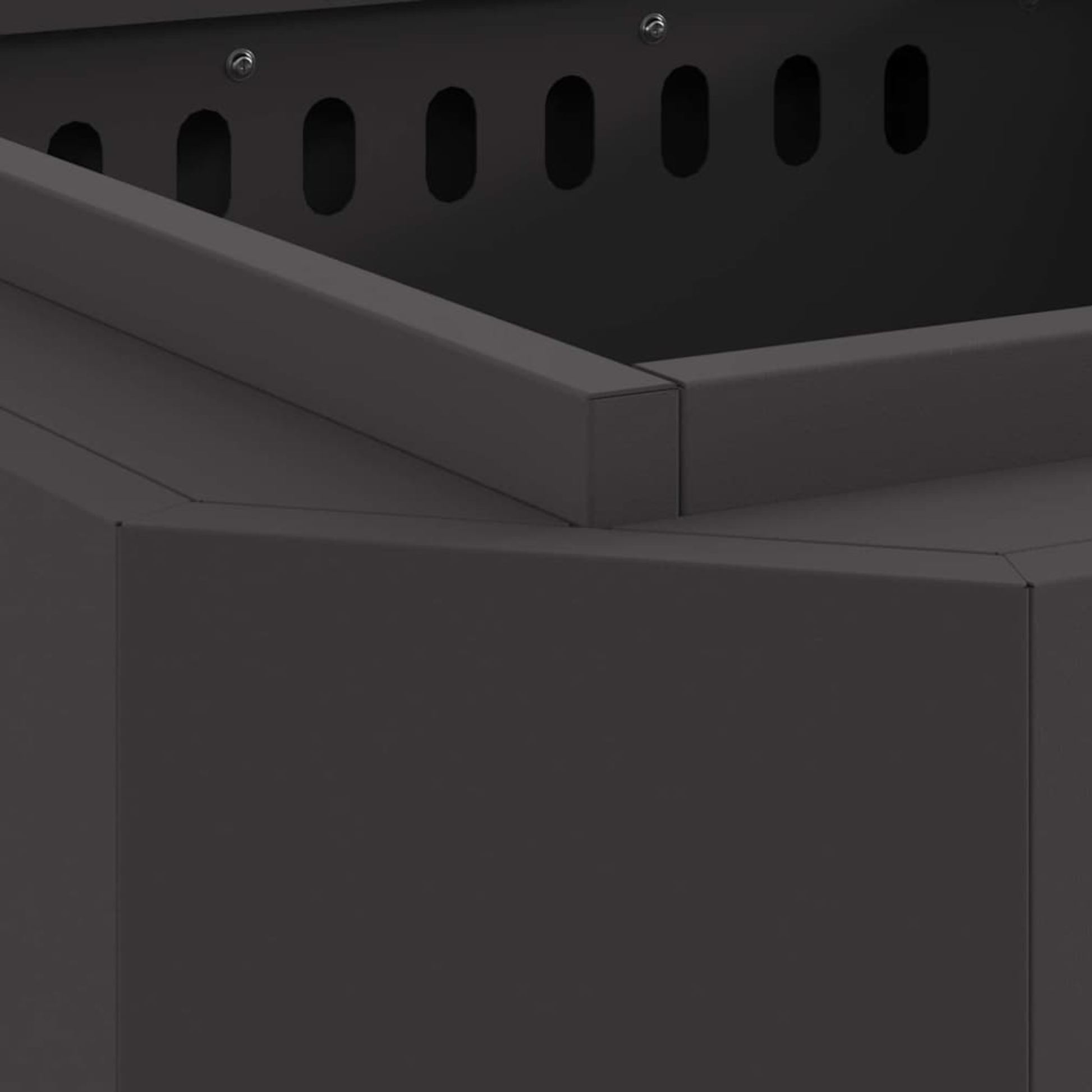 Close up of interior top rim and ventilation slots on black steel cube fire pit showing panel construction Pyrova