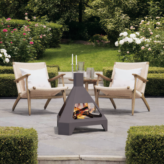 Triangle steel chiminea with fire in garden seating area - outdoor lifestyle - Pyrova
